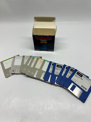 Vintage floppy disks with a box labeled 'Vestel' on a white background