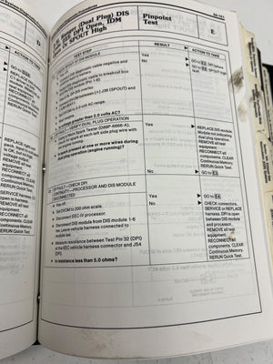 Open book with technical text and diagrams on a white background