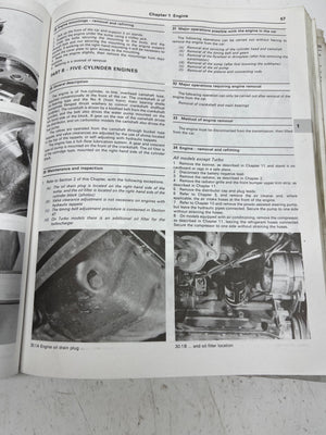 Open book with automotive repair instructions and diagrams on a white background