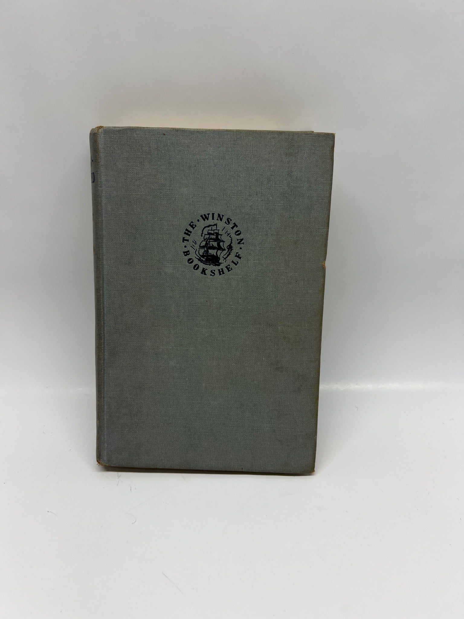Vintage book with a visible logo on the cover against a white background