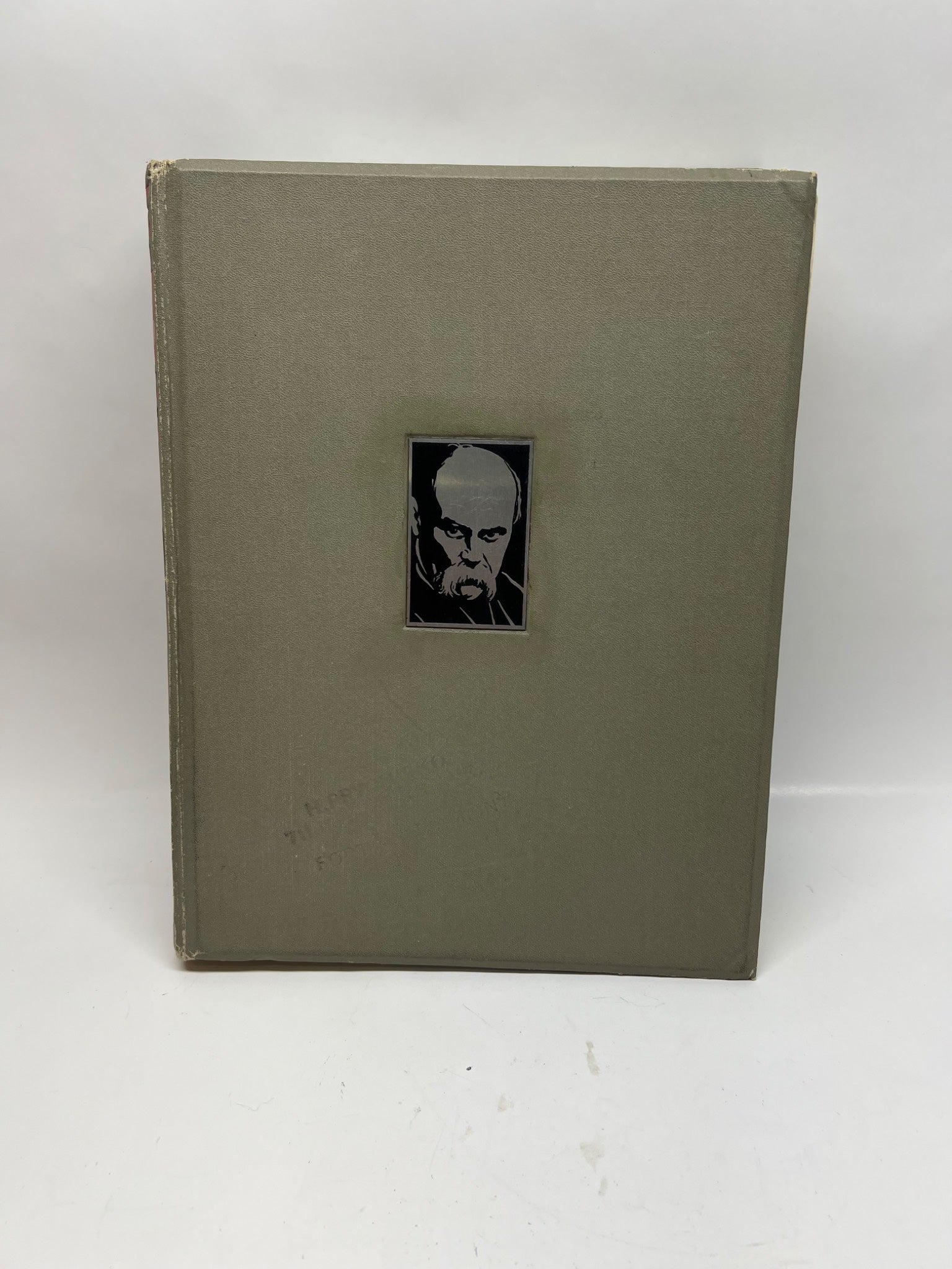 Book with a portrait on the cover against a white background