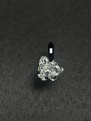 Clear crystal pendant on a black background