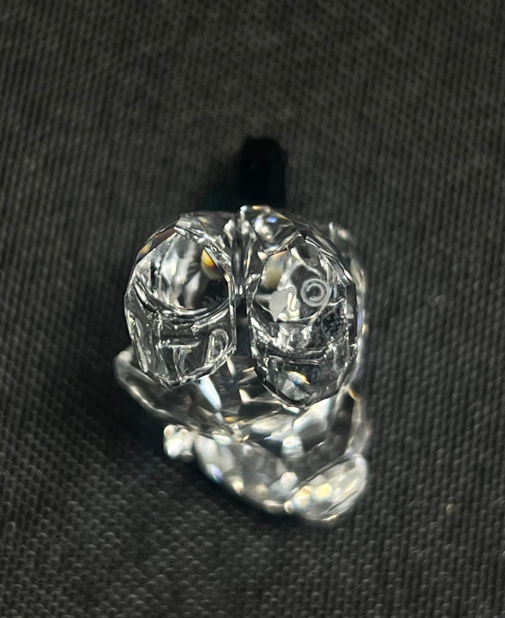 Clear glass knob on a black background