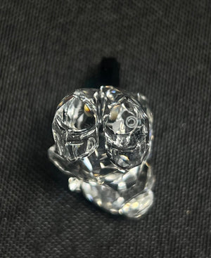 Clear glass knob on a black background