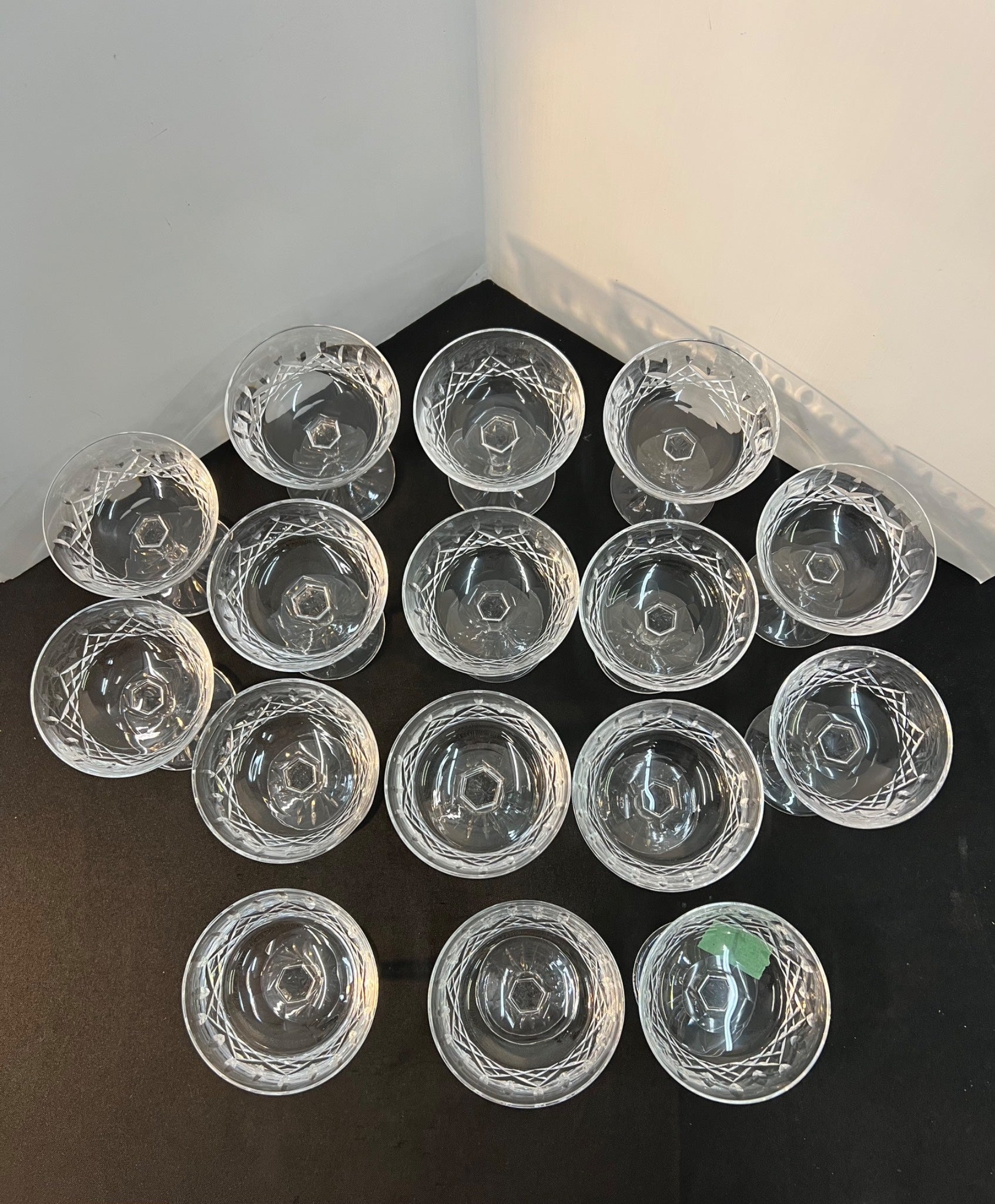 Clear glass dessert bowls arranged on a black surface with a white background