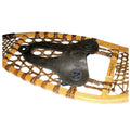 Close-up of a snowshoe with wooden frame and metal binding on a white background