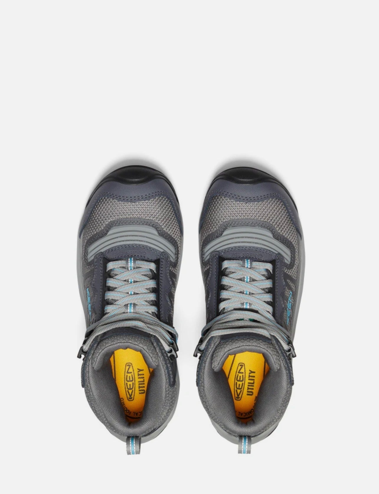 Pair of gray hiking shoes with yellow sole on a white background
