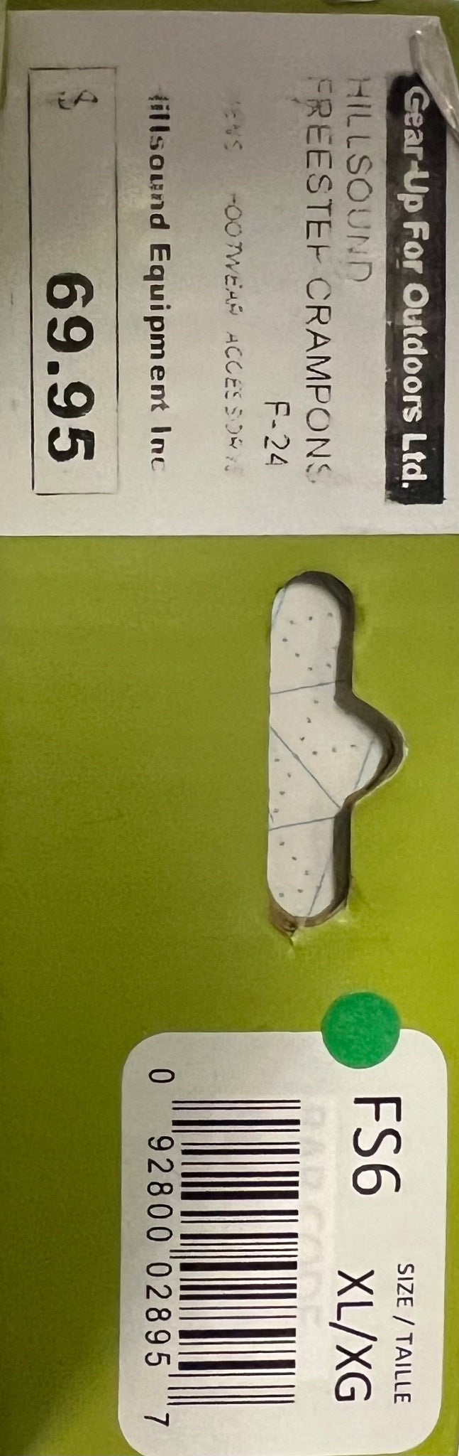 Small white plastic tool with a green label and bar code on a green background