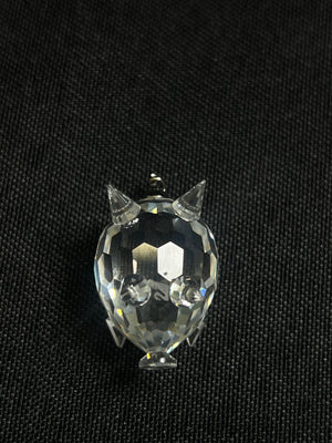 Crystal cat-shaped object on a black background