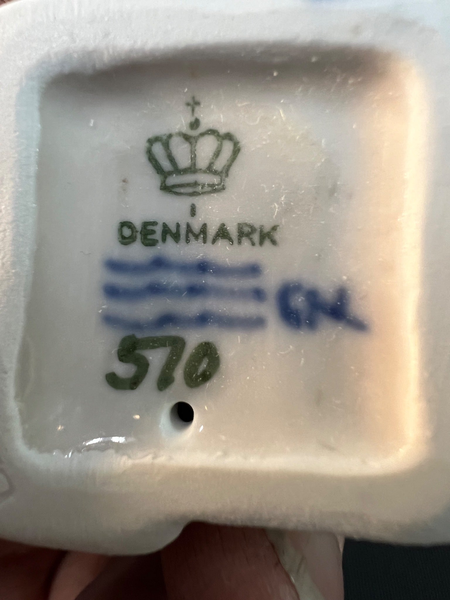 Ceramic product with 'Denmark' and number '570' branding on a white background