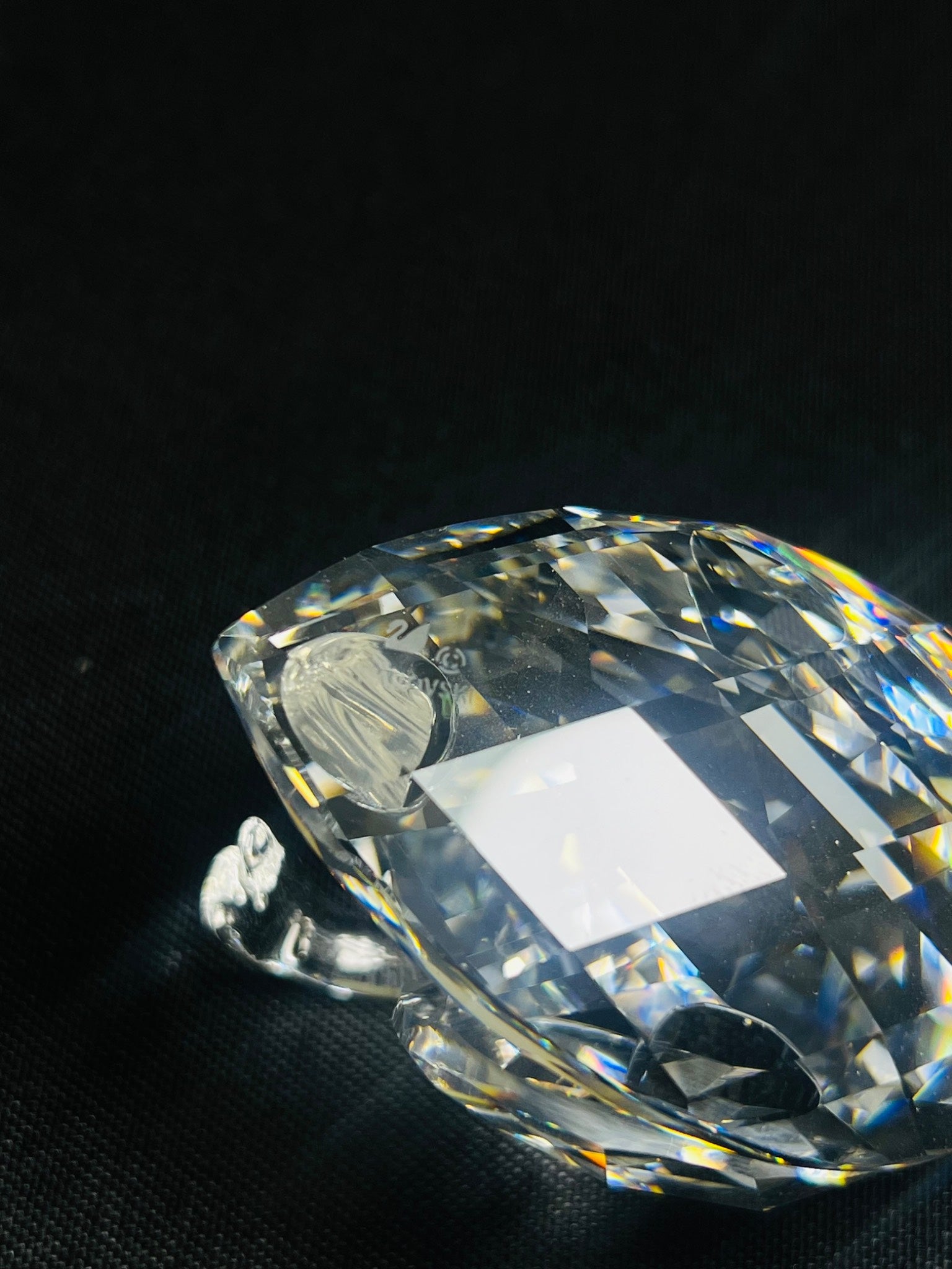 Clear crystal object on a black background