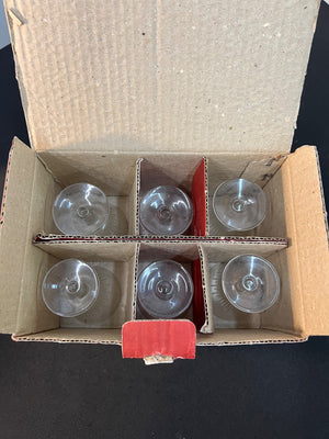 Cardboard box with six clear plastic suction cups on a black background
