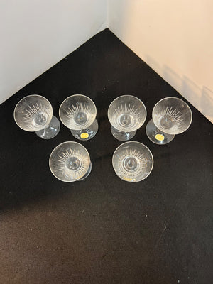 Set of clear glass bowls on a dark surface