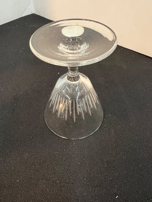 Clear glass object on a black surface