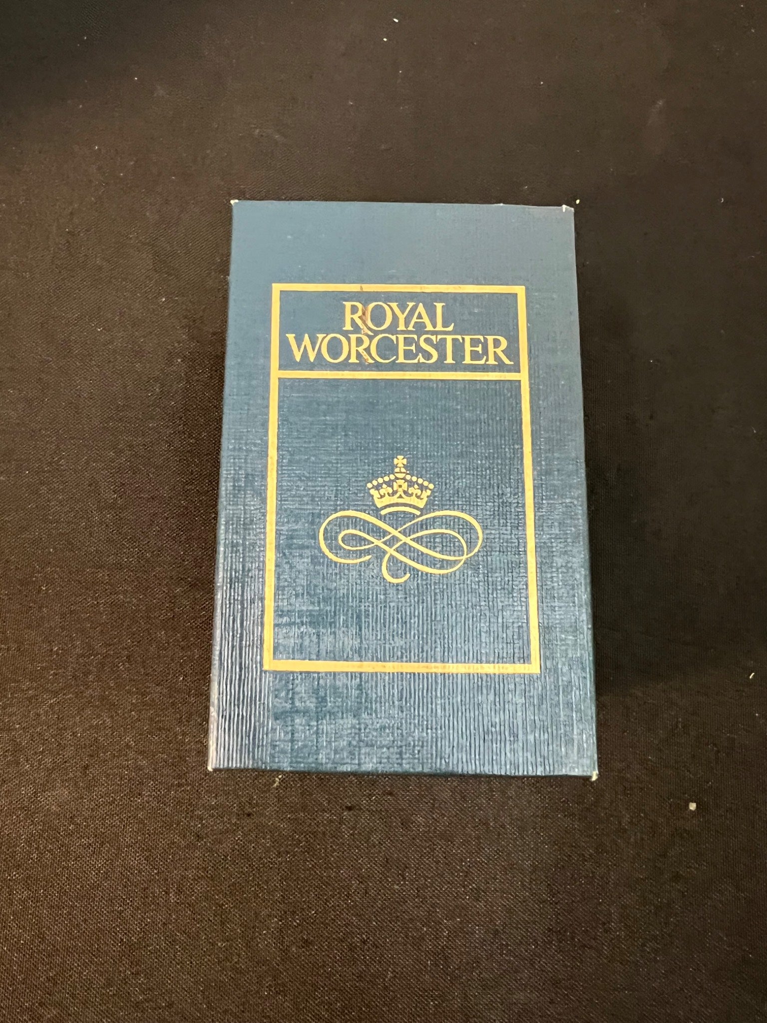 Blue box with 'Royal Worcester' branding on a brown background