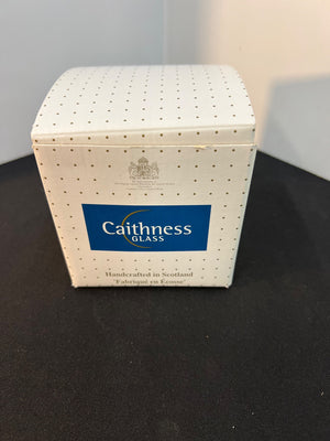 Caithness Glass box with blue logo on a black surface