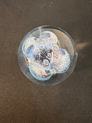 Transparent sphere with bubbles on a dark background