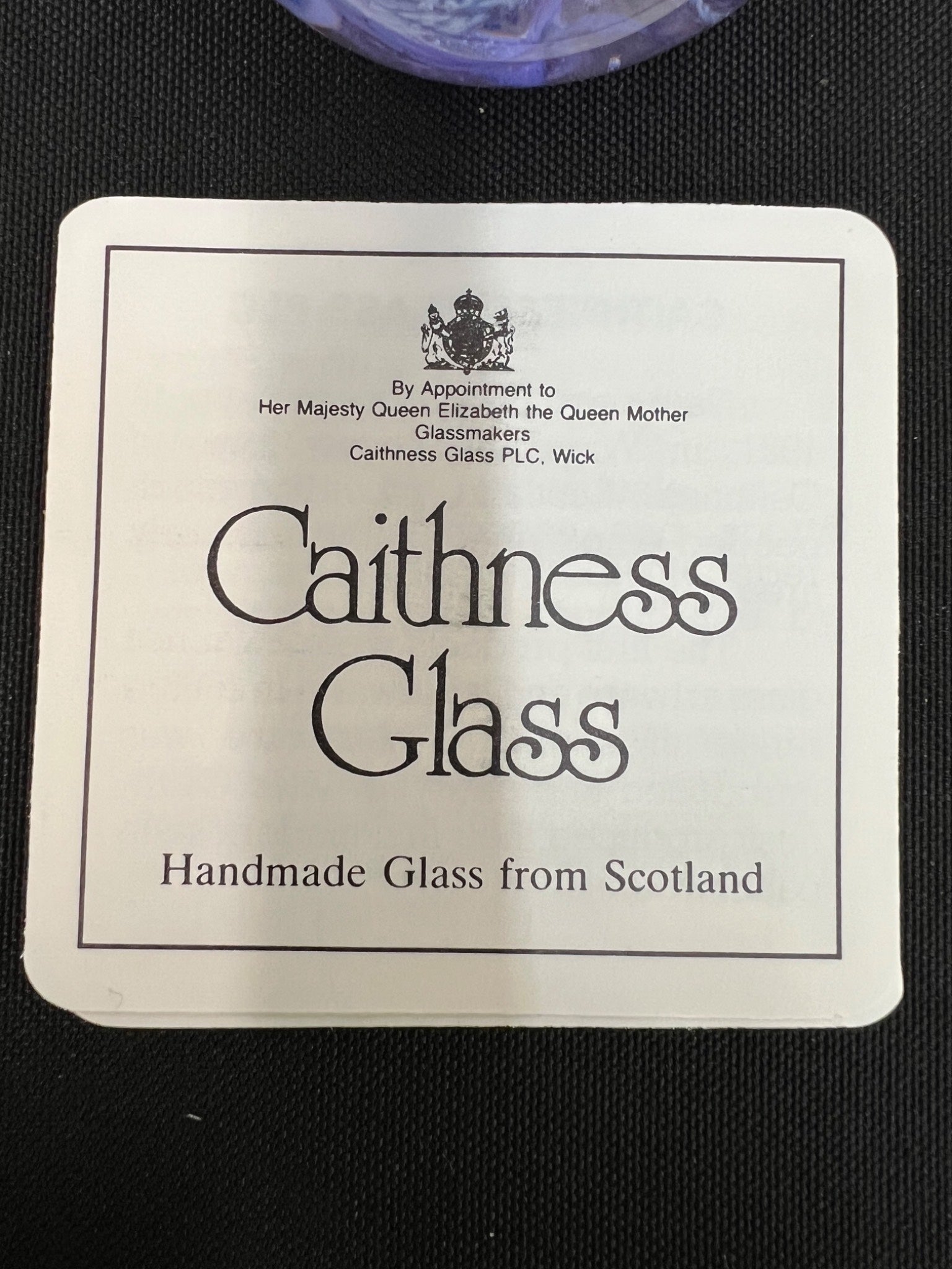 Caithness Glass label on a black background