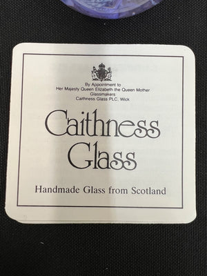Caithness Glass label on a black background