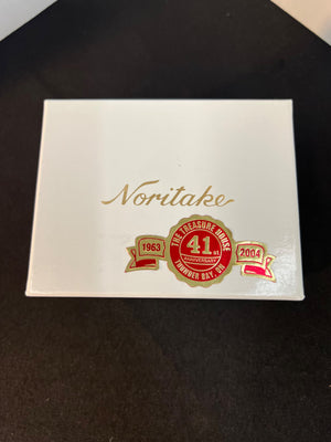 Noritake product with a red and gold emblem on a white background