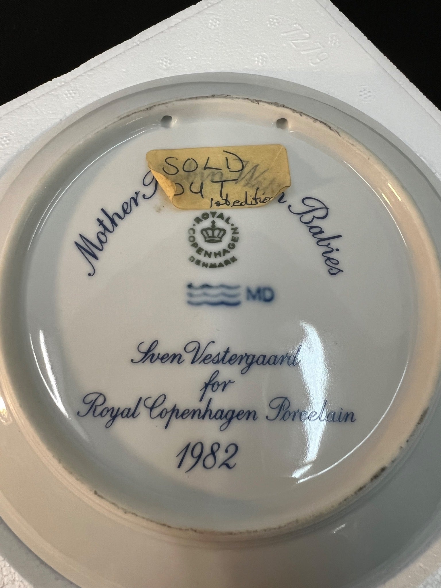 Royal Copenhagen porcelain plate with branding and text on a white background