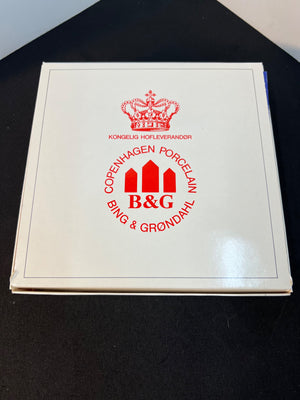 Copenhagen Porcelain Bing & Grondahl box with red logo on a black surface