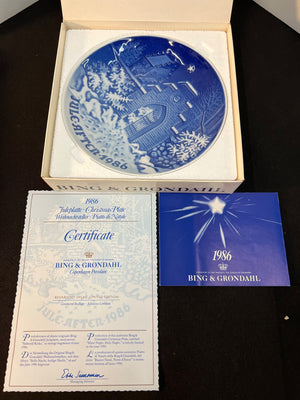 Bing & Grondahl plate with certificate and packaging on a dark surface