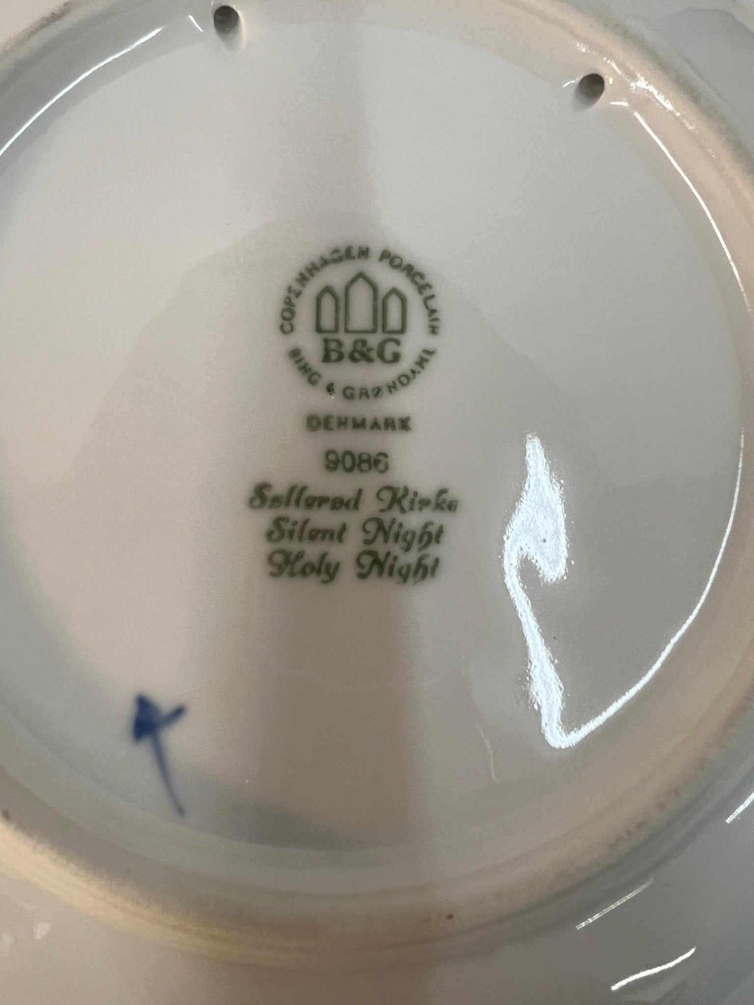 Copenhagen Porcelain Factory logo on a white plate with 'Silent Night' text