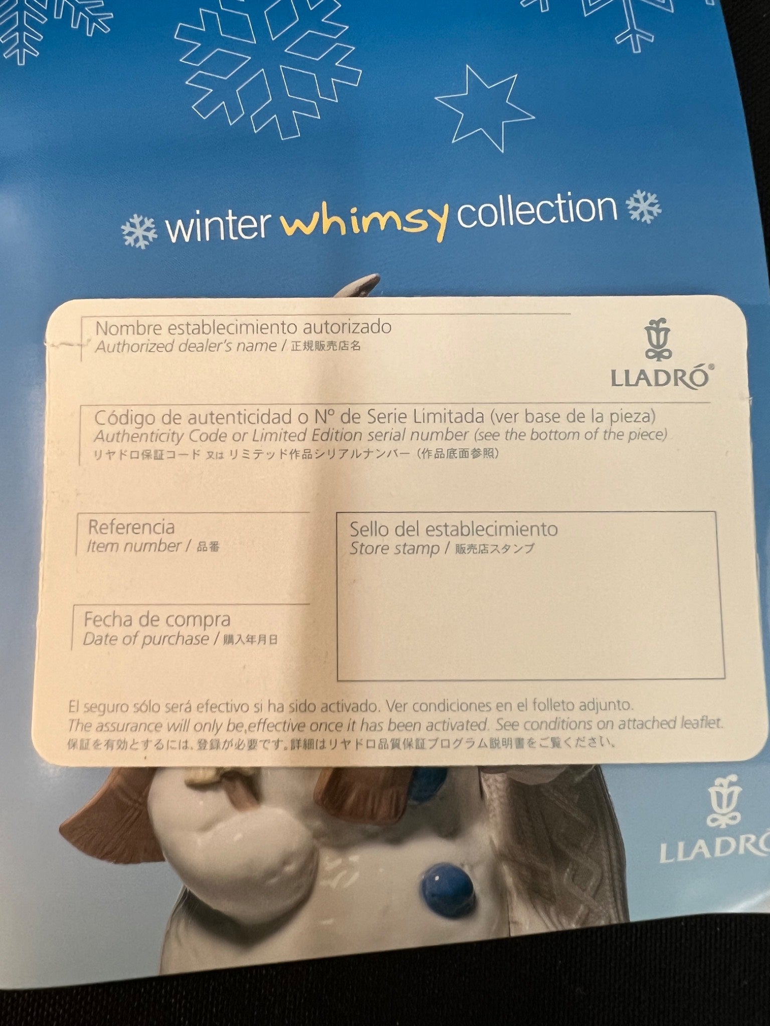 Lladro figurine packaging with 'winter whimsy collection' branding