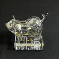 Crystal pig figurine on a black background