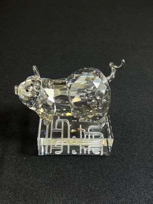 Crystal pig figurine on a black background