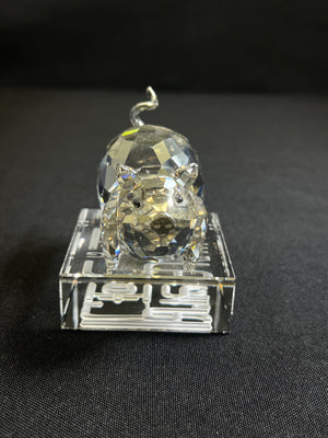 Clear crystal tiger figurine on a black background