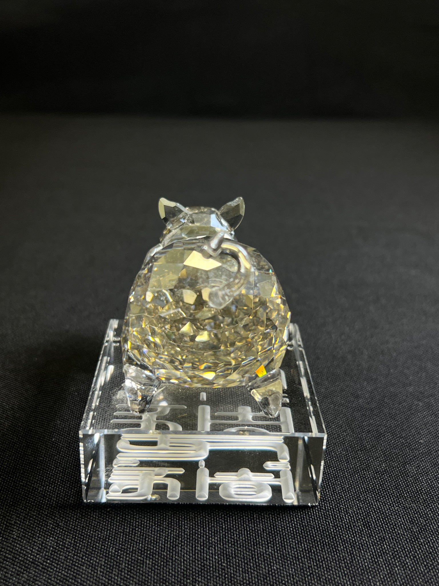 Crystal ball on a stand with a black background