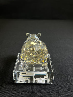 Crystal ball on a stand with a black background