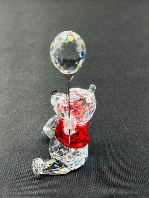 Crystal bear figurine with a bubble on a gray background