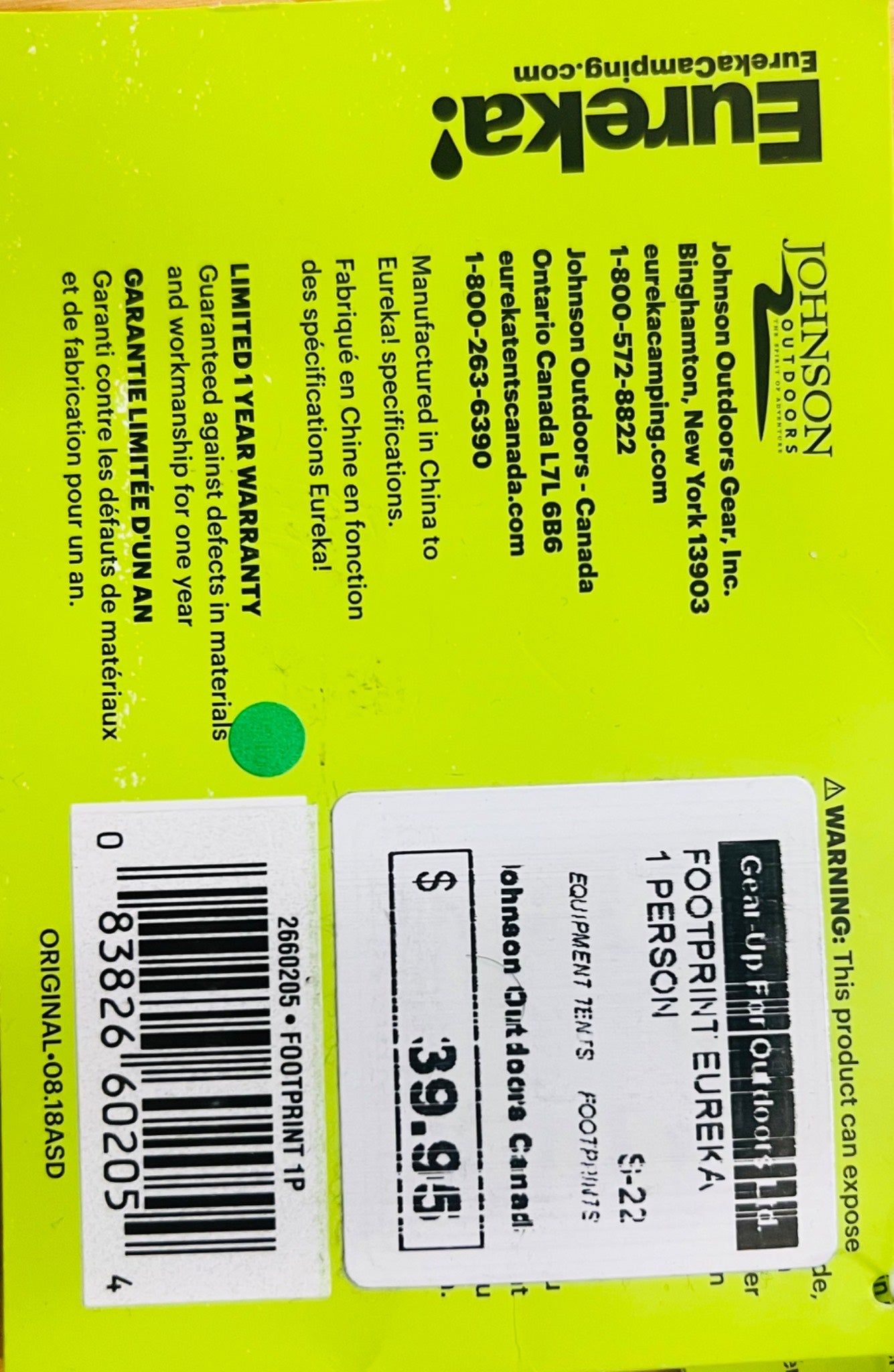 Backpack label with Eureka and Johnson Outdoor Gear branding on a bright yellow background