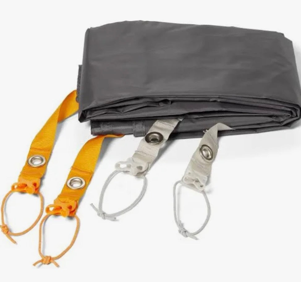 Gray tarp with orange and white straps on a white background