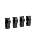 Four black plastic clips on a white background