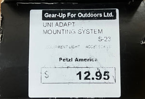 Label for Petzl America UNI ADAPT MOUNTING SYSTEM with price tag on a black background