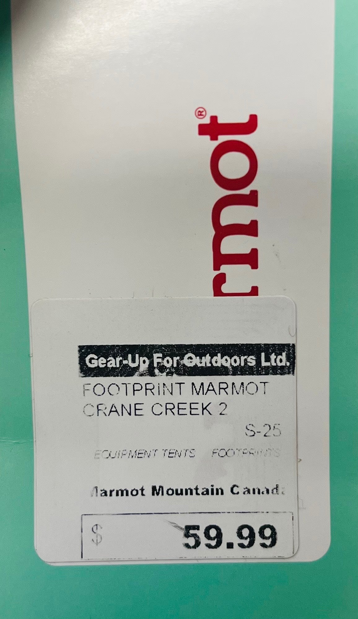 Marmot product label with branding and pricing on a green background