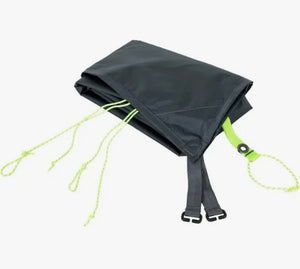 Black tarp with green straps on a white background