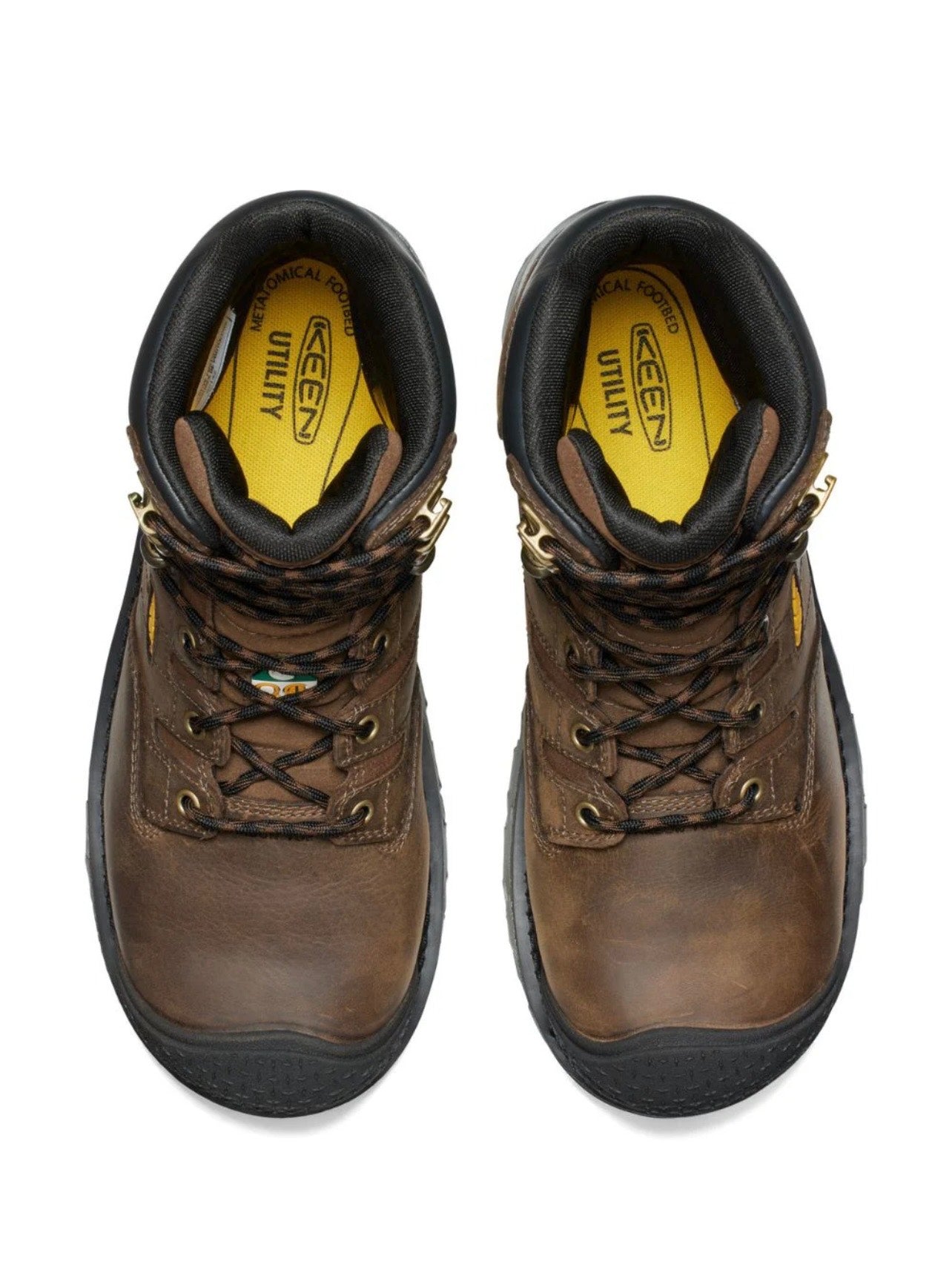 Pair of brown work boots with black soles on a white background