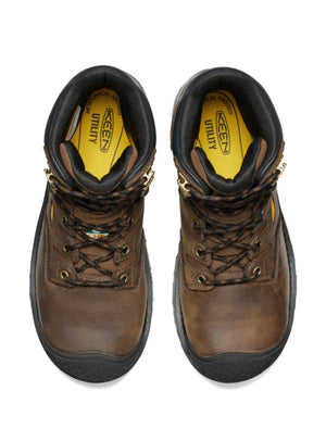 Pair of brown work boots with black soles on a white background