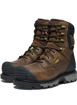 Brown hiking boot with black sole on a white background