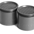 Two gray metal canisters with perforated tops on a white background