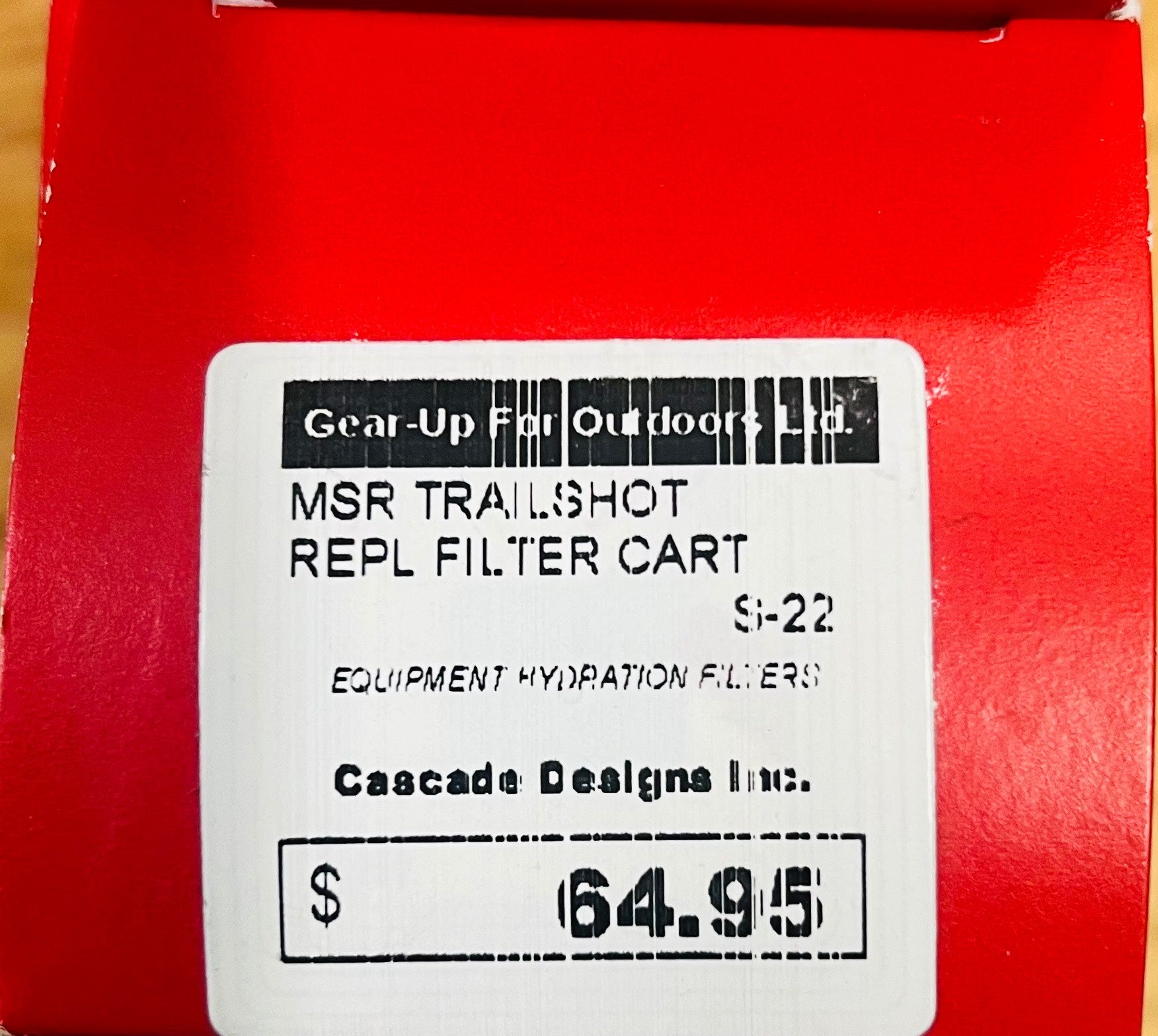 Red box with a label for MSR Trailshot REPL FILTER CART and pricing information.