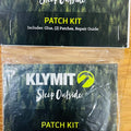 Klymit patch kit with repair guide on a wooden surface