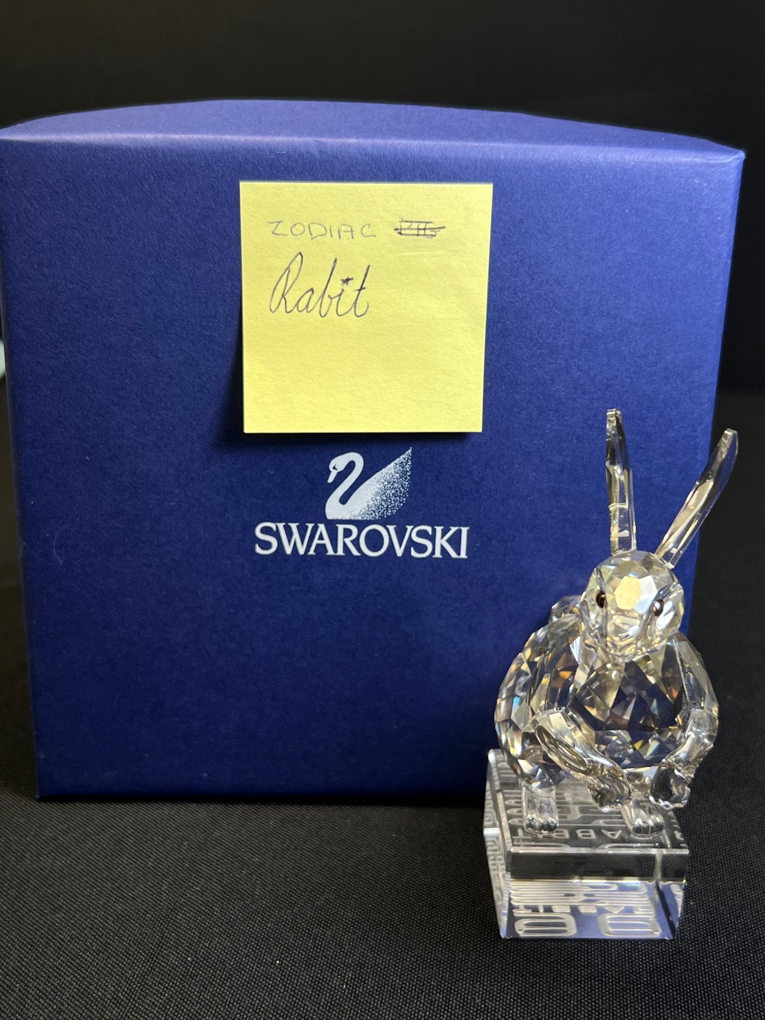 Crystal rabbit figurine in front of a Swarovski branded box