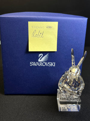 Crystal rabbit figurine in front of a Swarovski branded box