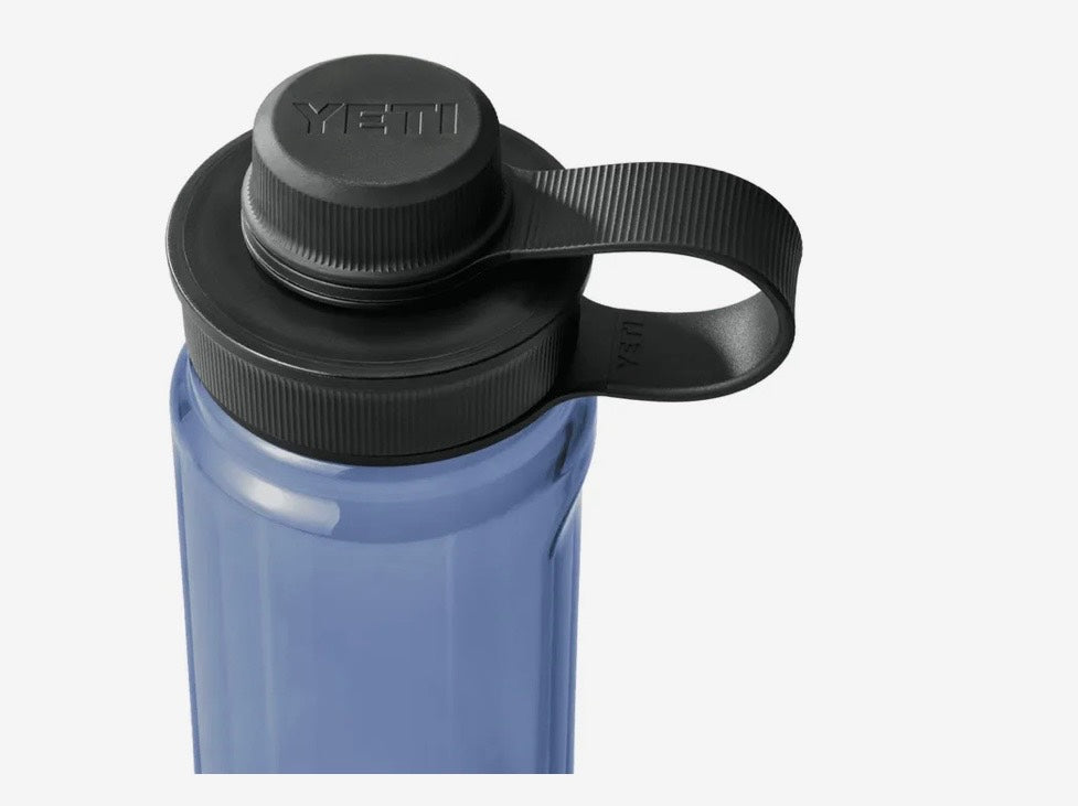 Blue YETI water bottle with black lid and handle on a white background